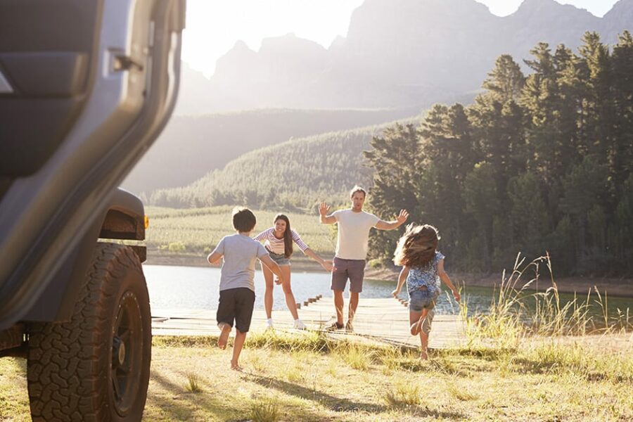 Family by the lake on a local road trip