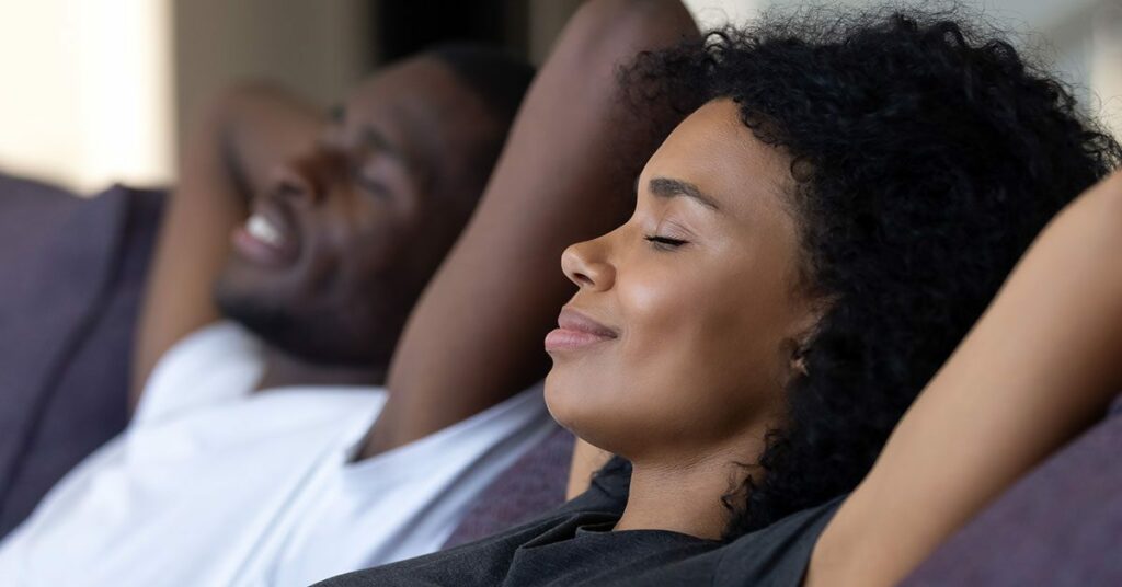 A woman and her partner free from financial stress