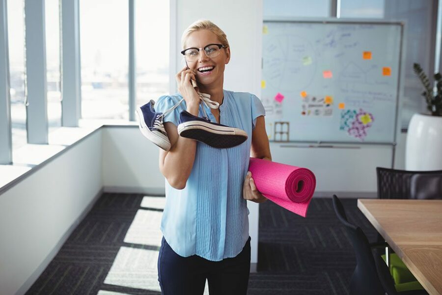Smiling executive talking on mobile phone