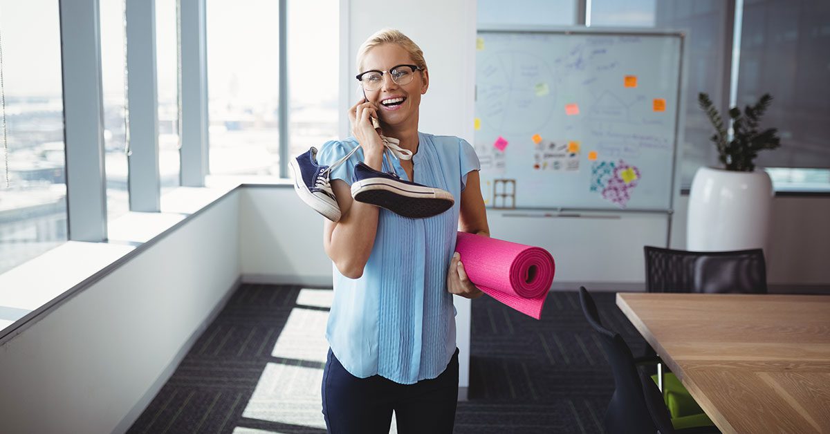 Smiling executive talking on mobile phone