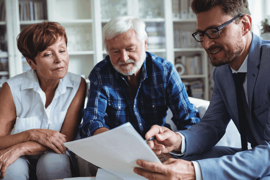 Senior couple doing estate planning with Advisor