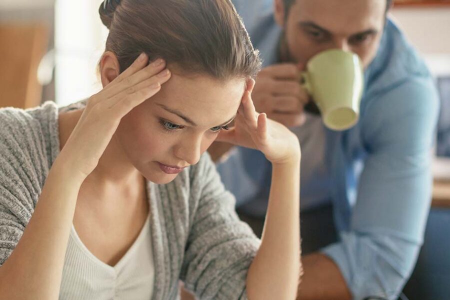 Worried couple looking at their bills