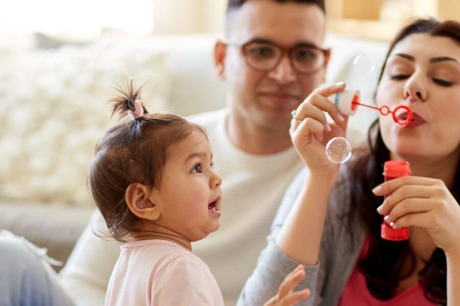 Young family playing with their toddler