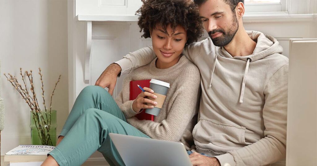 Couple looking at laptop