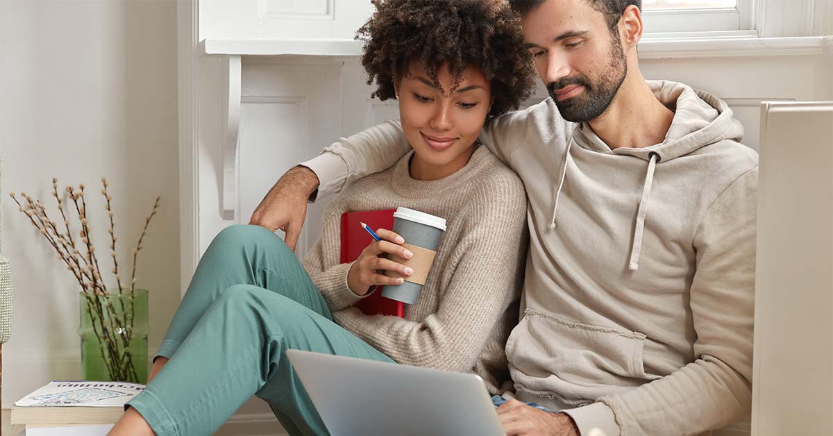Couple looking at laptop